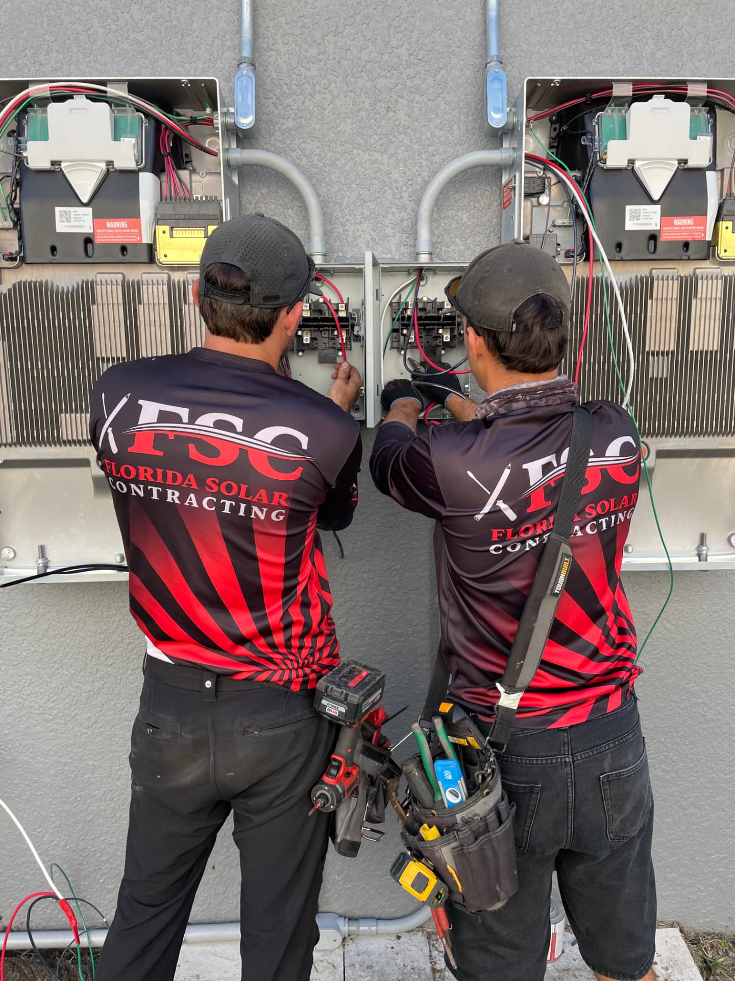 FSC technicians servicing exterior solar equipment